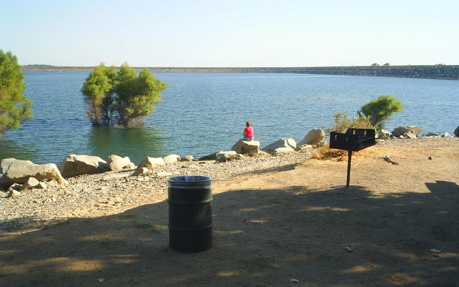 Folsom Lake in the Sierra Nevada foothills, representing the region's outdoor recreation, water resources, and natural landscape that attract growing families and professionals.